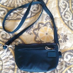 NWT PACSAFE cross body and hip purse.